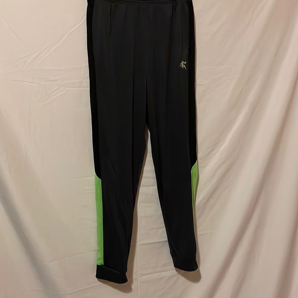 Gray jogging pants with black and green stripes on the legs.